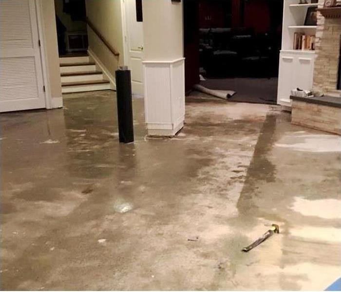 Residential basement water damage flooding and water on floors and walls