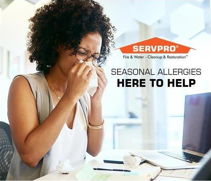 woman with allergies at an office desk