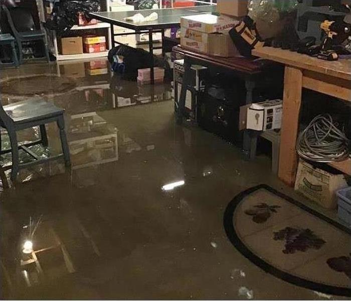 storm flooding in basement with several inches of contaminated water