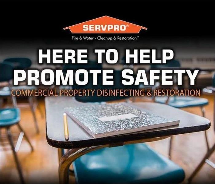 classroom desk and notebook with SERVPRO logo