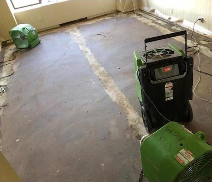 water damage to floors and walls of this residential property 